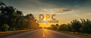 sun in horizon over asphalt road